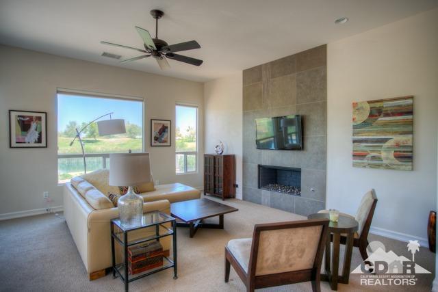 374 Loch Lomond Road Rancho Mirage, CA 92270 - Photo 8 of 38 a living room with furniture and a fireplace