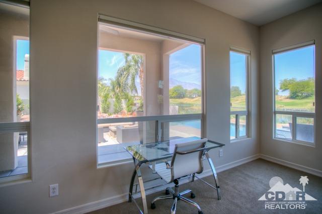 374 Loch Lomond Road Rancho Mirage, CA 92270 - Photo 9 of 38 a view of a dining room with furniture and a window