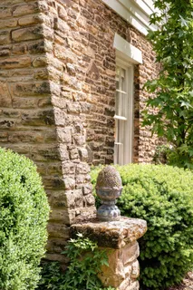 an aerial view of a house with yard and outdoor seating