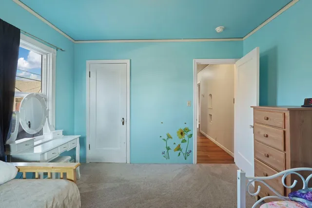 a view of a bedroom with baby bed