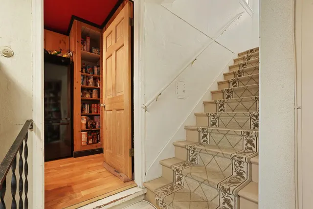 wooden floor with white walls