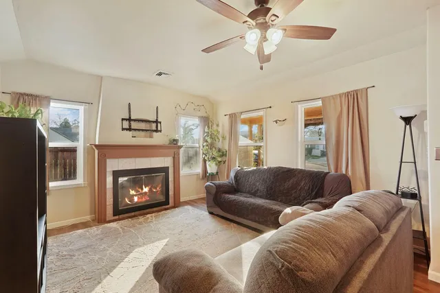 a living room with furniture and a fireplace