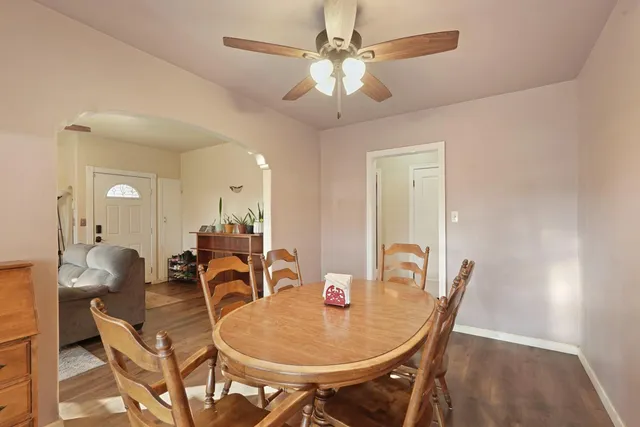 a dining room with furniture and window