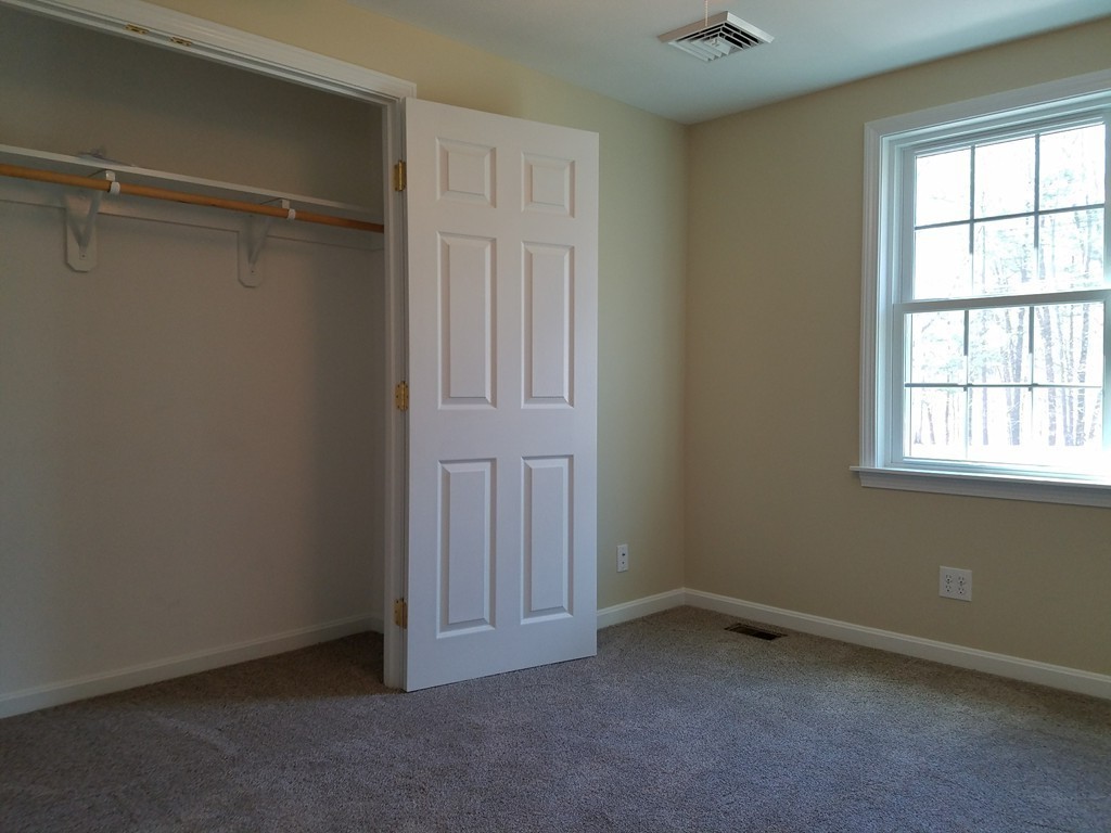 52 School House Road Groton, MA 01450 - Photo 11 of 27 a view of an empty room with a window