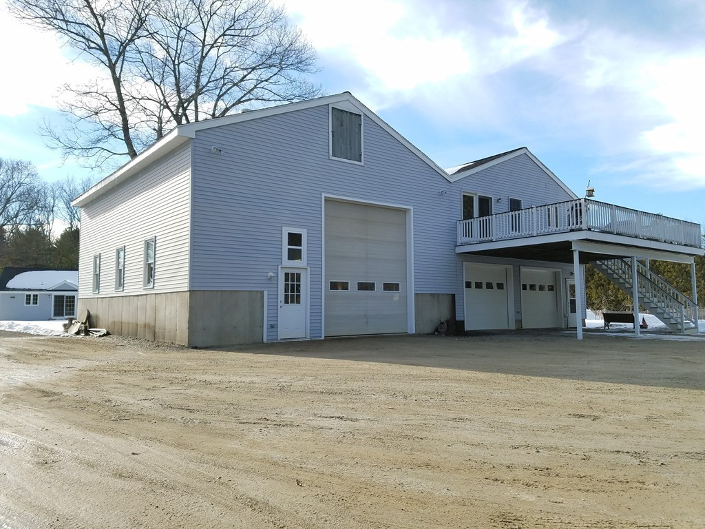52 School House Road Groton, MA 01450 - Photo 13 of 27 a view of a house with a big yard and large tree