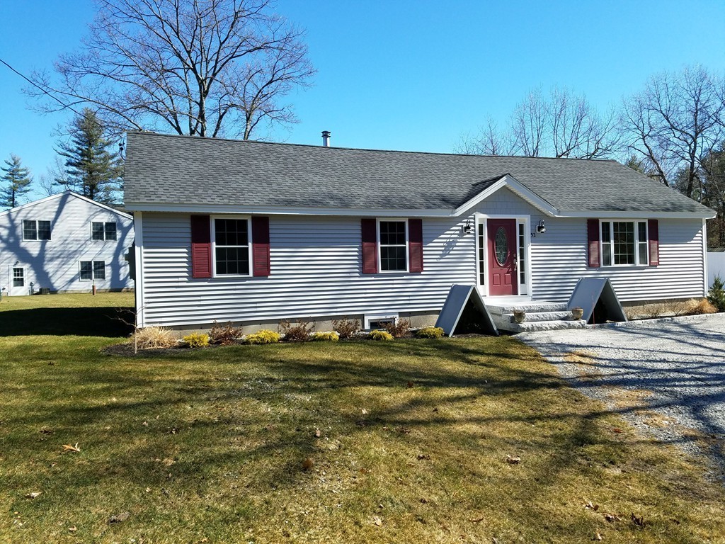 52 School House Road Groton, MA 01450 - Photo 3 of 27 a view of a house with a patio