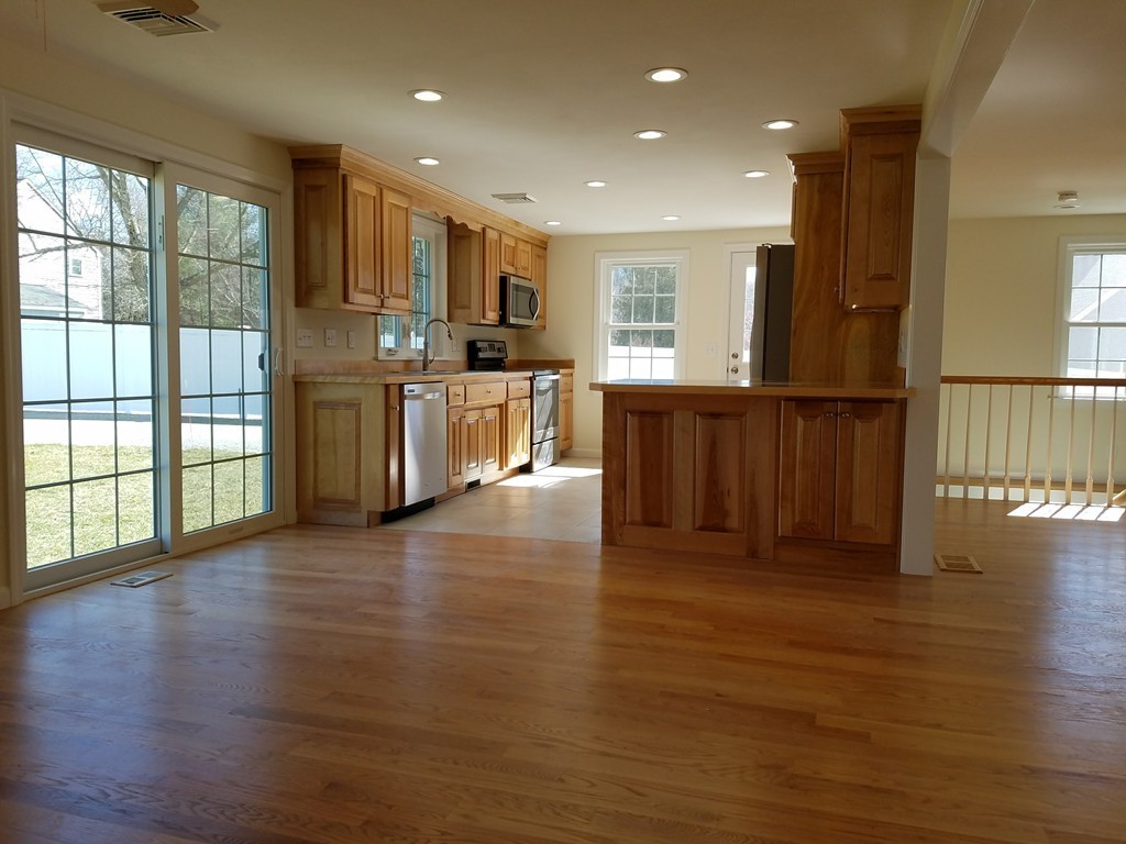 52 School House Road Groton, MA 01450 - Photo 6 of 27 a view of kitchen with wooden floor