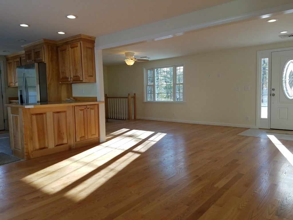 52 School House Road Groton, MA 01450 - Photo 8 of 27 a view of kitchen with wooden floor and window