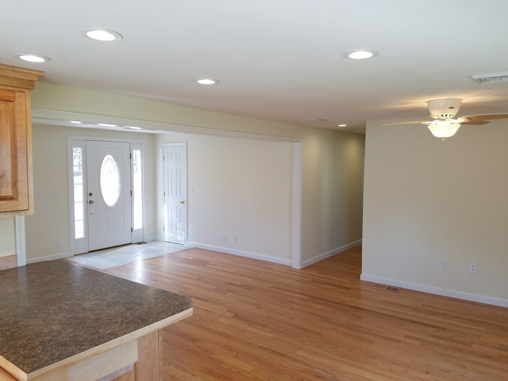 52 School House Road Groton, MA 01450 - Photo 9 of 27 wooden floor in an empty room with wooden floor