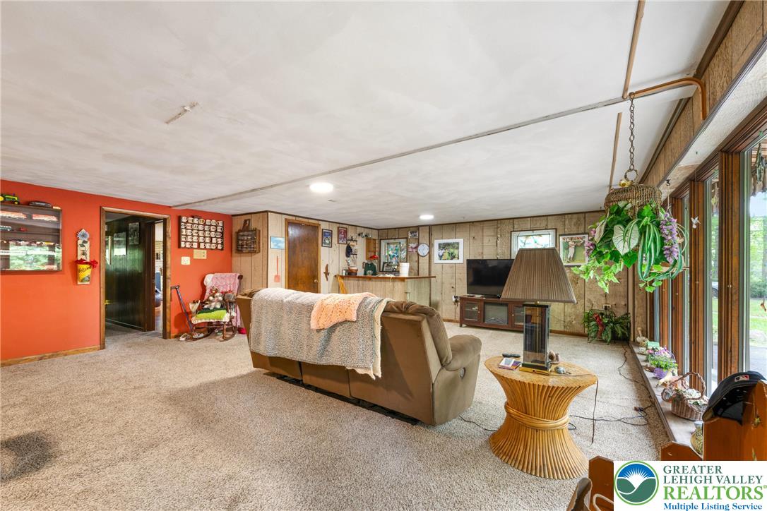 1471 State Road Coopersburg, PA 18036 - Photo 38 of 73 a bed room with furniture and a potted plant