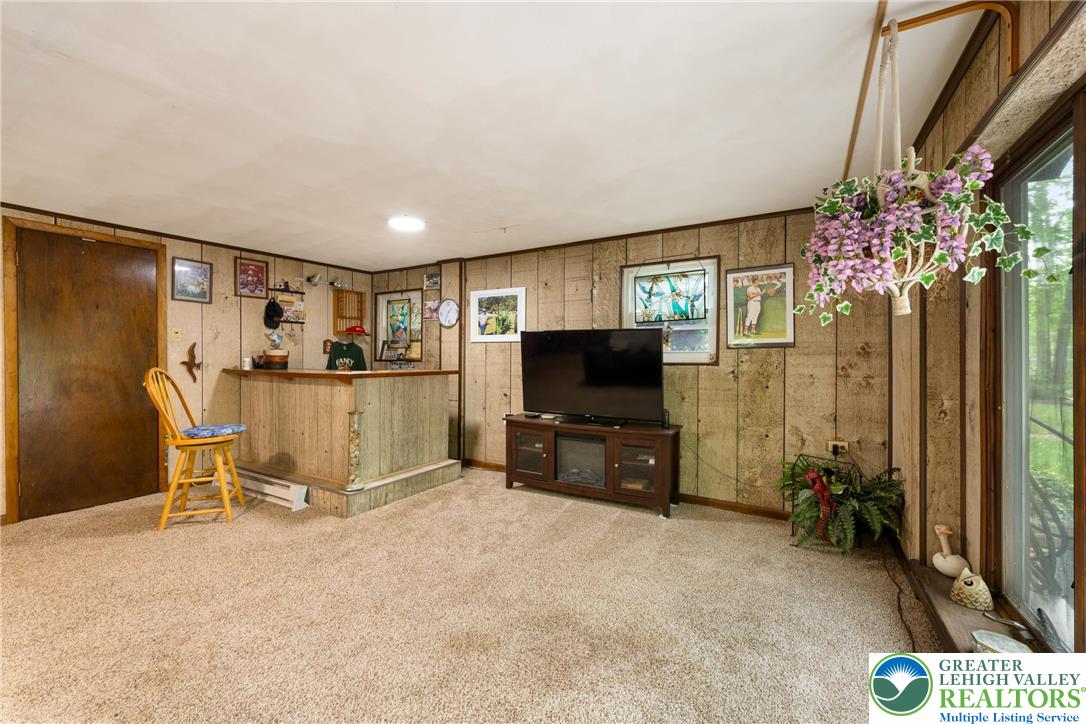 1471 State Road Coopersburg, PA 18036 - Photo 40 of 73 a living room with furniture and a flat screen tv