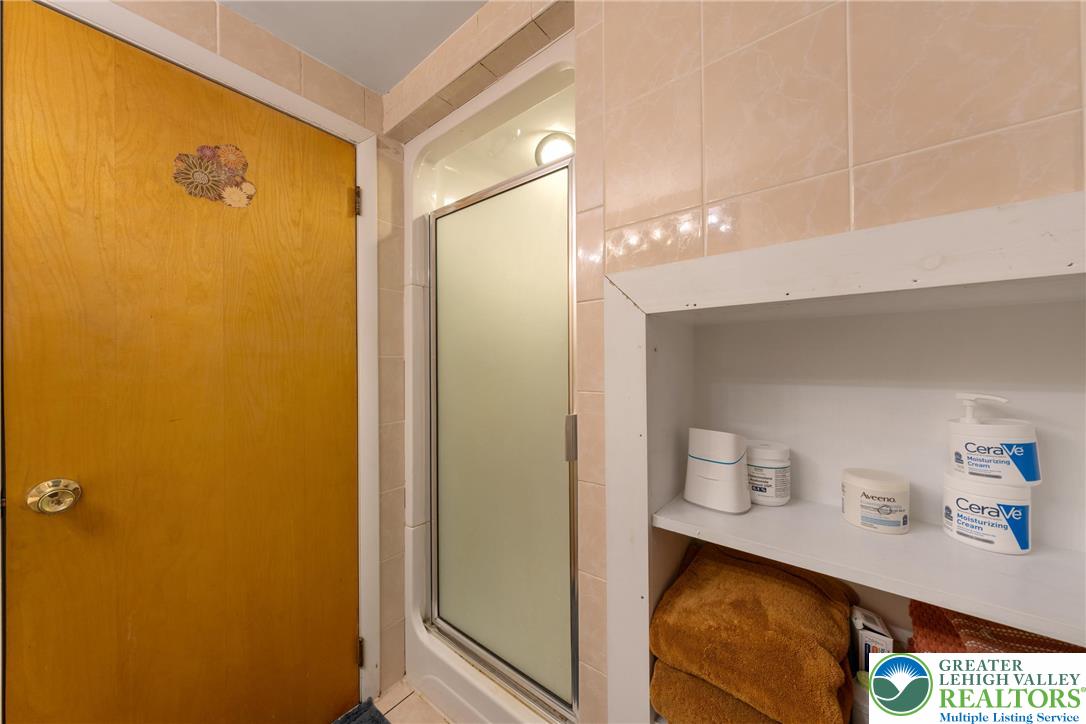 1471 State Road Coopersburg, PA 18036 - Photo 45 of 73 a bathroom with a sink mirror and vanity