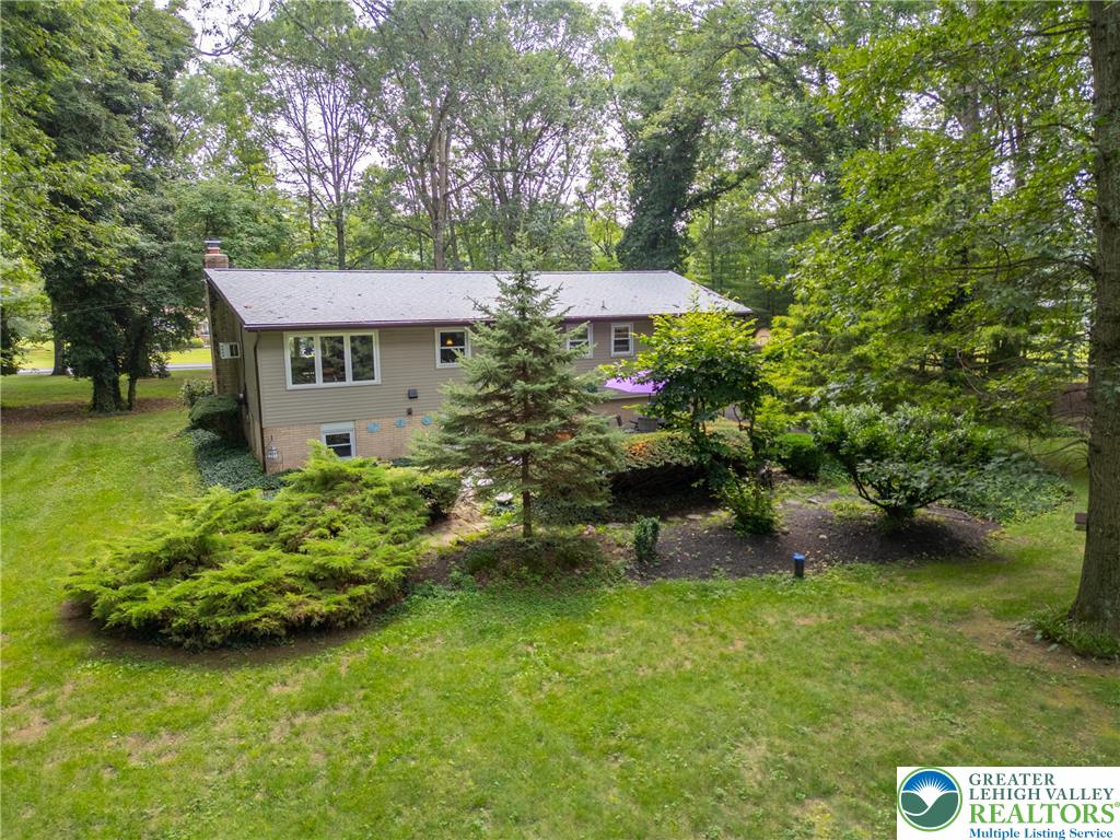 1471 State Road Coopersburg, PA 18036 - Photo 59 of 73 a view of a house with a yard and a fountain