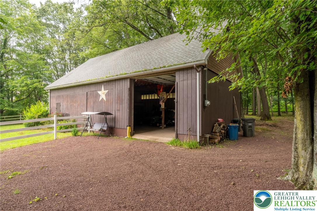 1471 State Road Coopersburg, PA 18036 - Photo 62 of 73 a view of a house with backyard patio and swimming pool