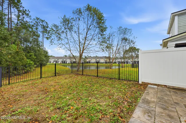 a view of a park with large trees