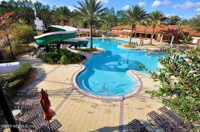 a view of a swimming pool with a patio