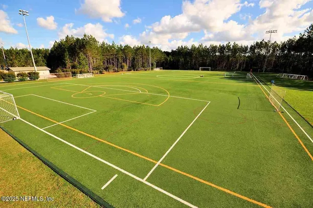 a view of an outdoor space and tennis court