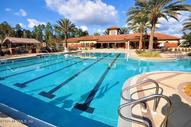 a view of a swimming pool with a lounge chairs