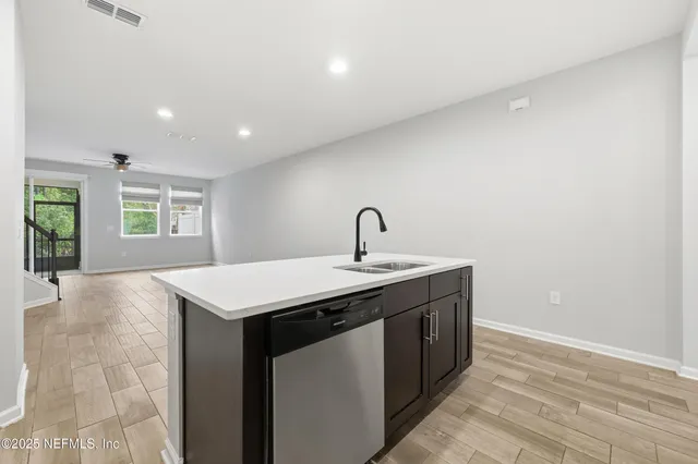 a kitchen with a sink and window