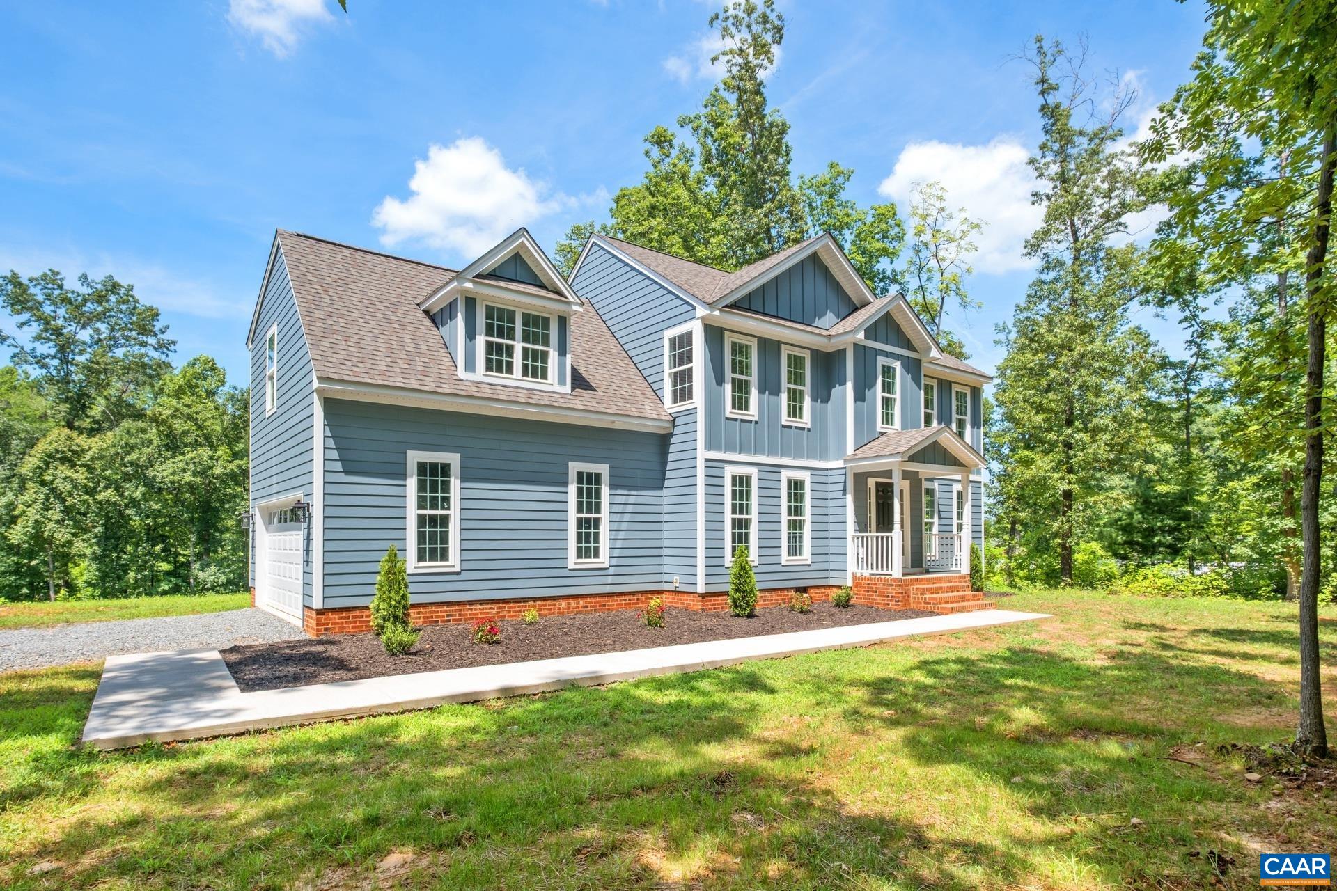 2211 Carpenters Mill Road Ruckersville, VA 22968 - Photo 4 of 25 a front view of a house with a yard