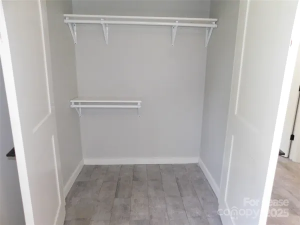 a view of an empty walk in closet