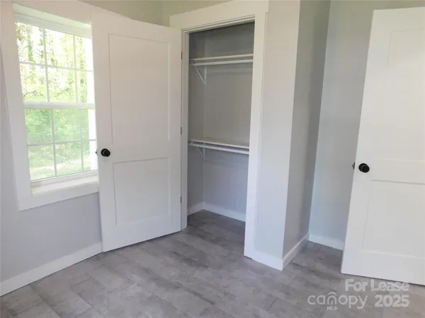 a view of an empty room with a window