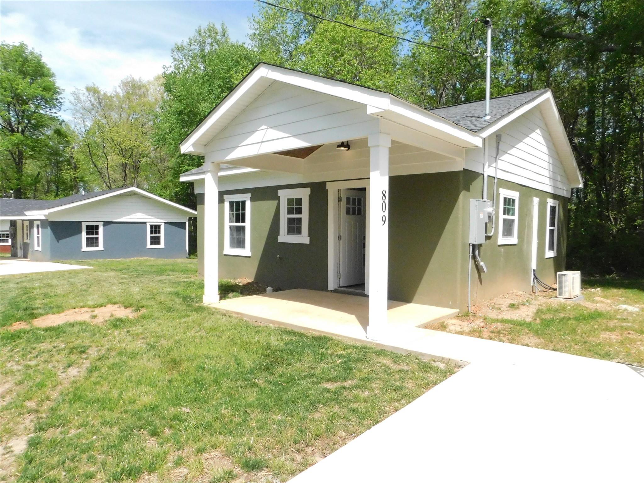 809 Marve Street Gastonia, NC 28052 - Photo 2 of 19 a view of a house with a yard and potted plants