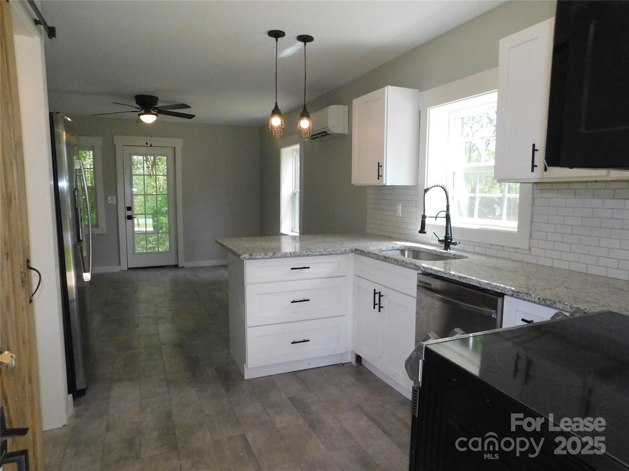 809 Marve Street Gastonia, NC 28052 - Photo 5 of 19 a kitchen with a sink stove and cabinets