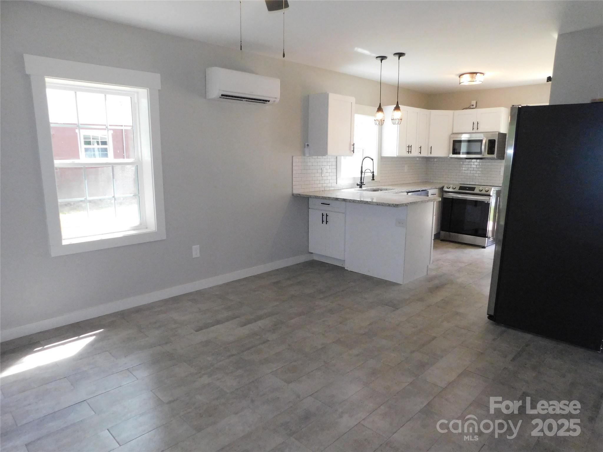 809 Marve Street Gastonia, NC 28052 - Photo 7 of 19 a large kitchen with cabinets and stainless steel appliances