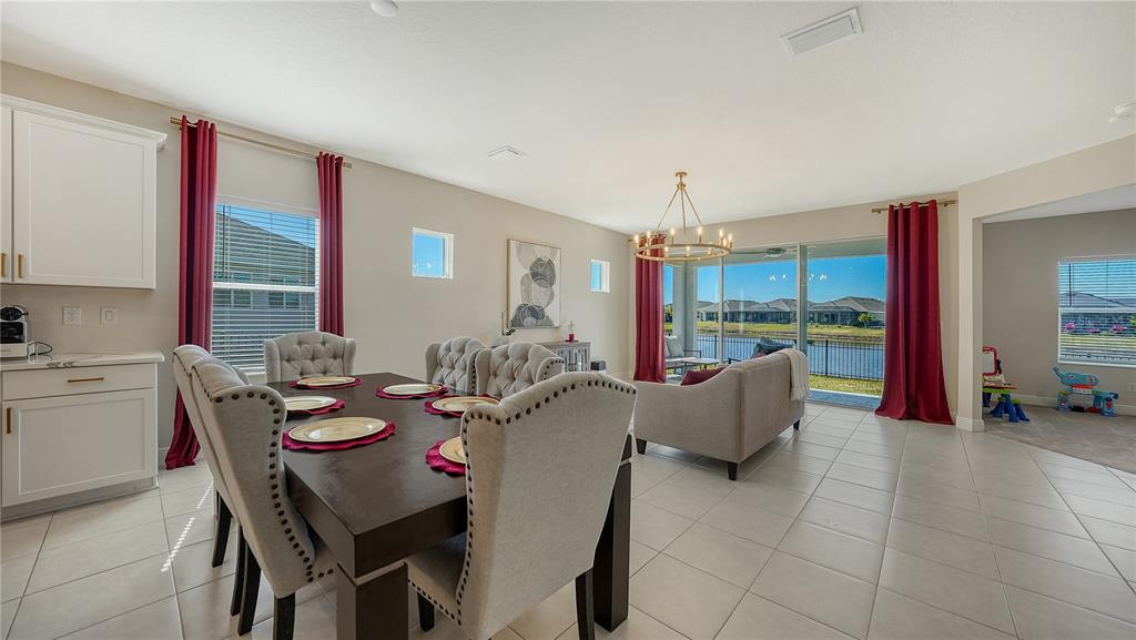 11869 Richmond Trail Parrish, FL 34219 - Photo 19 of 68 a view of a dining room with furniture and window