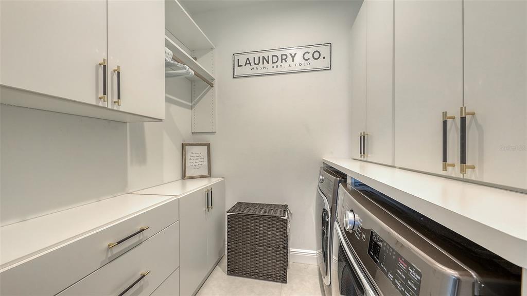 11869 Richmond Trail Parrish, FL 34219 - Photo 25 of 68 a utility room with cabinets