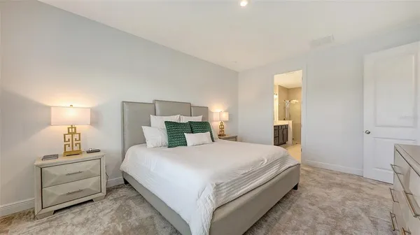 a view of walk in closet with clothes