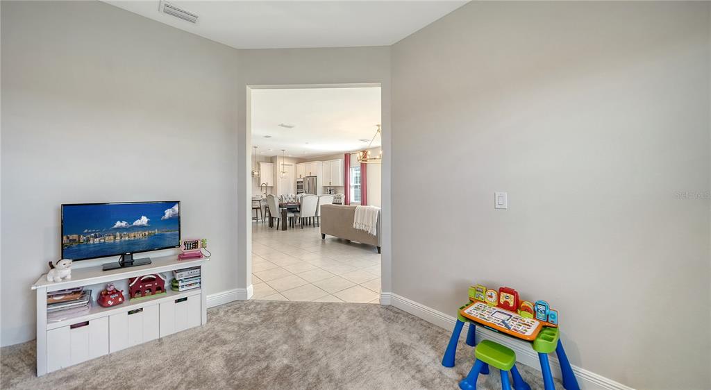 11869 Richmond Trail Parrish, FL 34219 - Photo 39 of 68 a living room with furniture and a flat screen tv