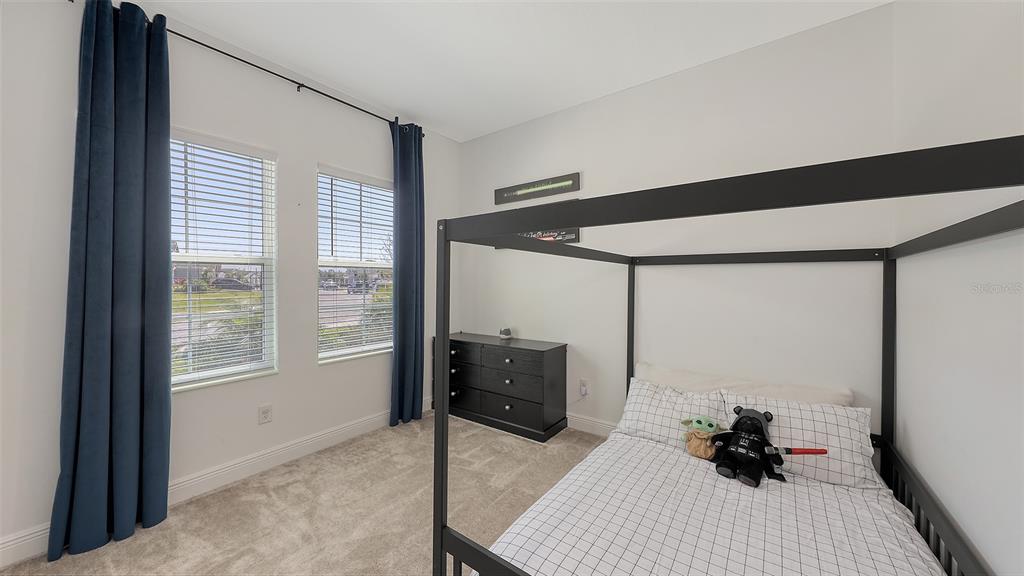 11869 Richmond Trail Parrish, FL 34219 - Photo 41 of 68 a room with a bed and a window