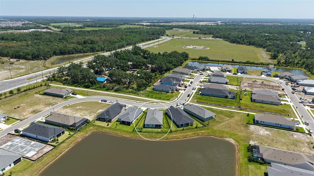 11869 Richmond Trail Parrish, FL 34219 - Photo 50 of 68 an aerial view of a house with a swimming pool