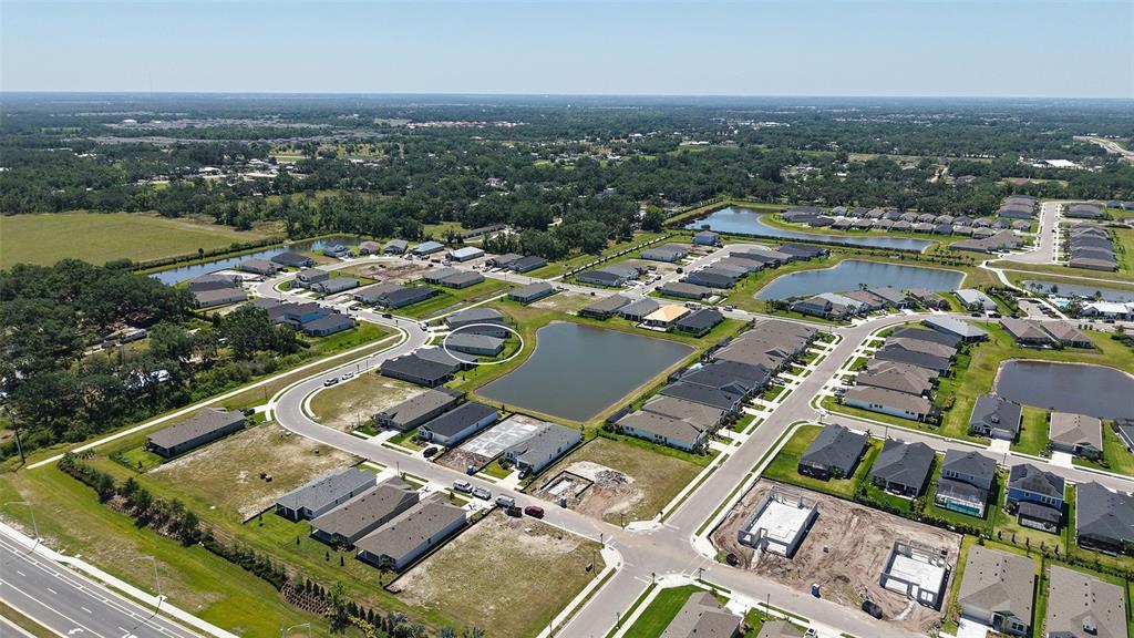 11869 Richmond Trail Parrish, FL 34219 - Photo 55 of 68 an aerial view of a city with lake view