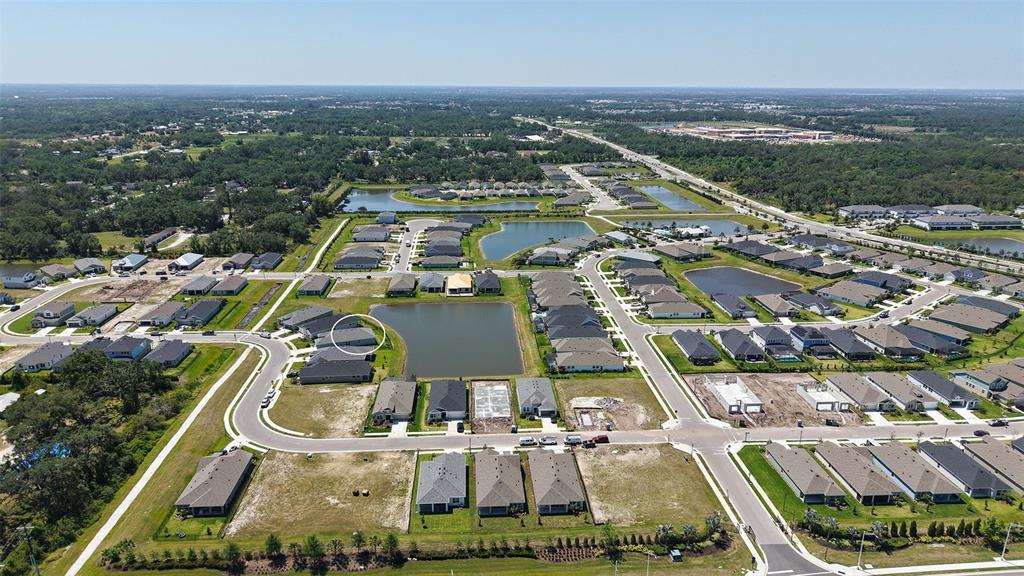 11869 Richmond Trail Parrish, FL 34219 - Photo 56 of 68 an aerial view of residential houses with outdoor space