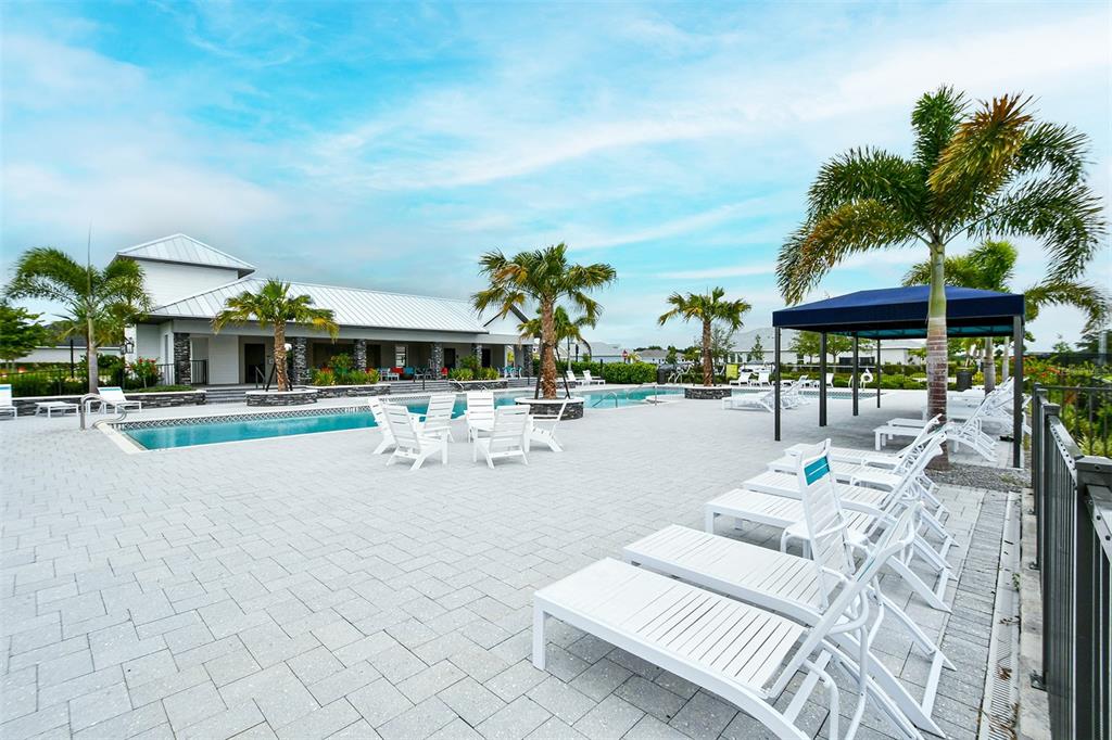 11869 Richmond Trail Parrish, FL 34219 - Photo 65 of 68 a view of a patio with swimming pool table and chairs