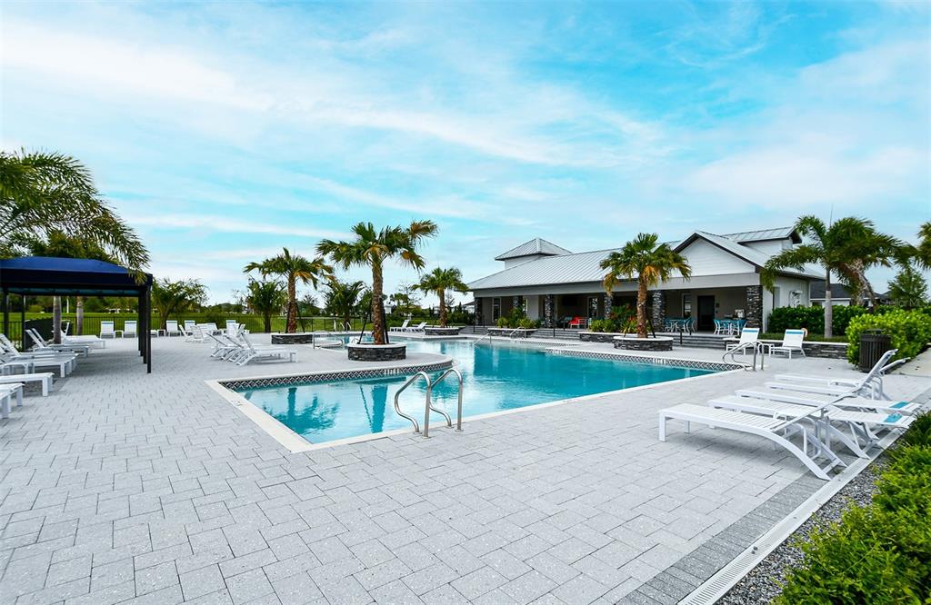 11869 Richmond Trail Parrish, FL 34219 - Photo 66 of 68 a view of a swimming pool with sitting area and furniture