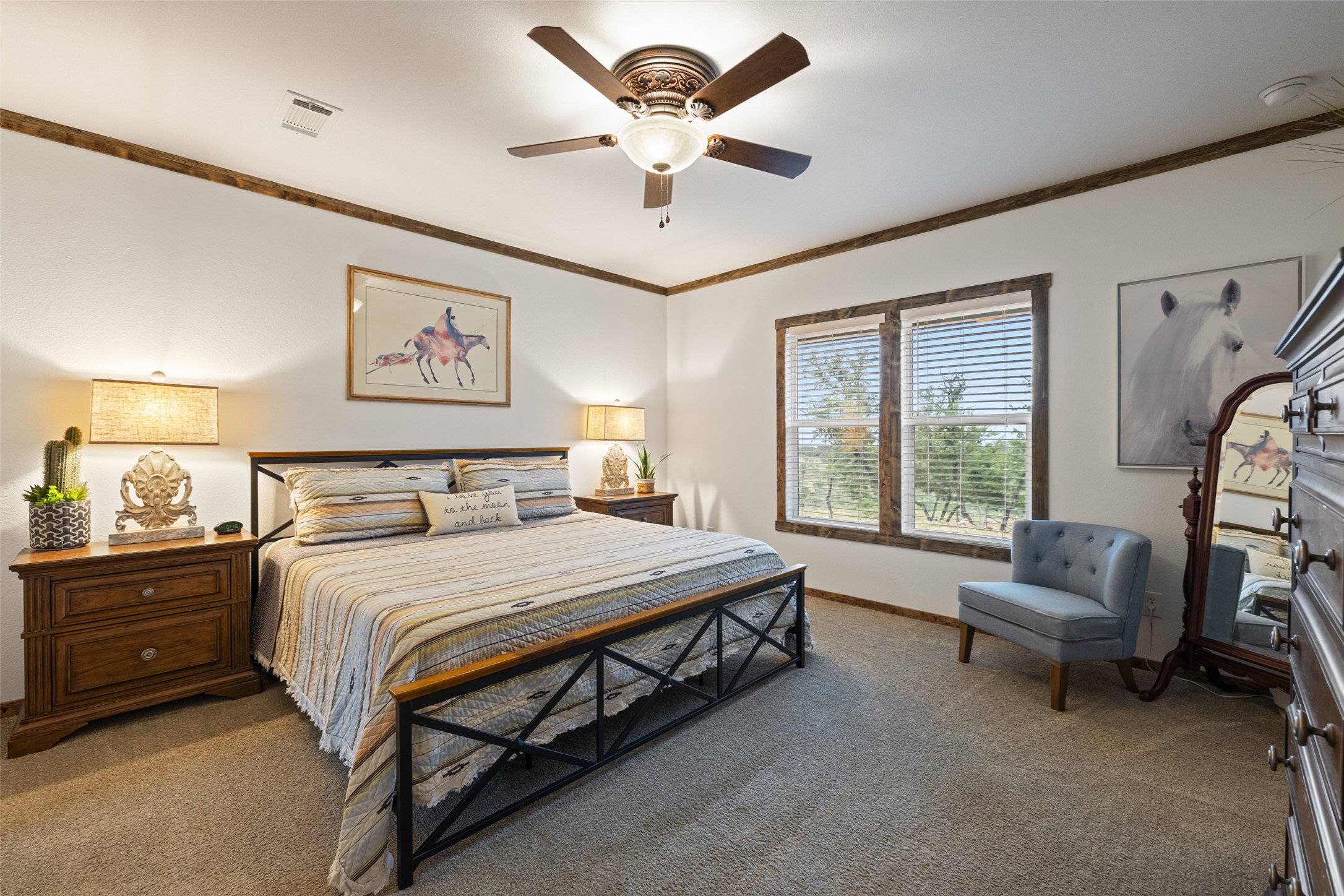 830 Ulrich Road Johnson City, TX 78636 - Photo 23 of 40 A tranquil bedroom provides comfort with its soft carpeting and a window offering a natural view.