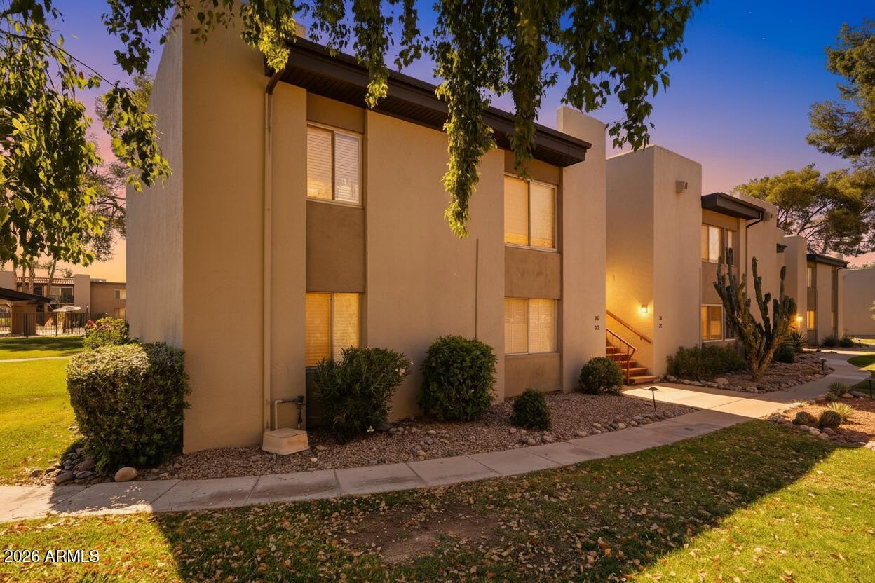4201 East Camelback Road, Unit 34 Phoenix, AZ 85018 - Photo 1 of 19 a view of a house with backyard and garden