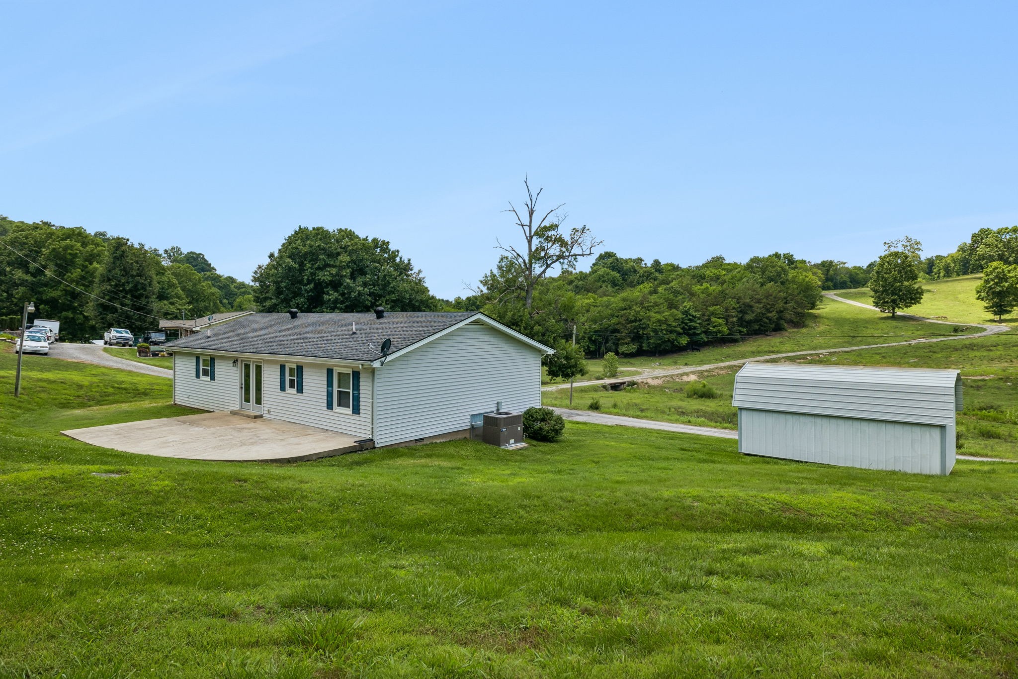 14 Morris Lane Carthage, TN 37030 - Photo 10 of 31 a view of a house with a backyard