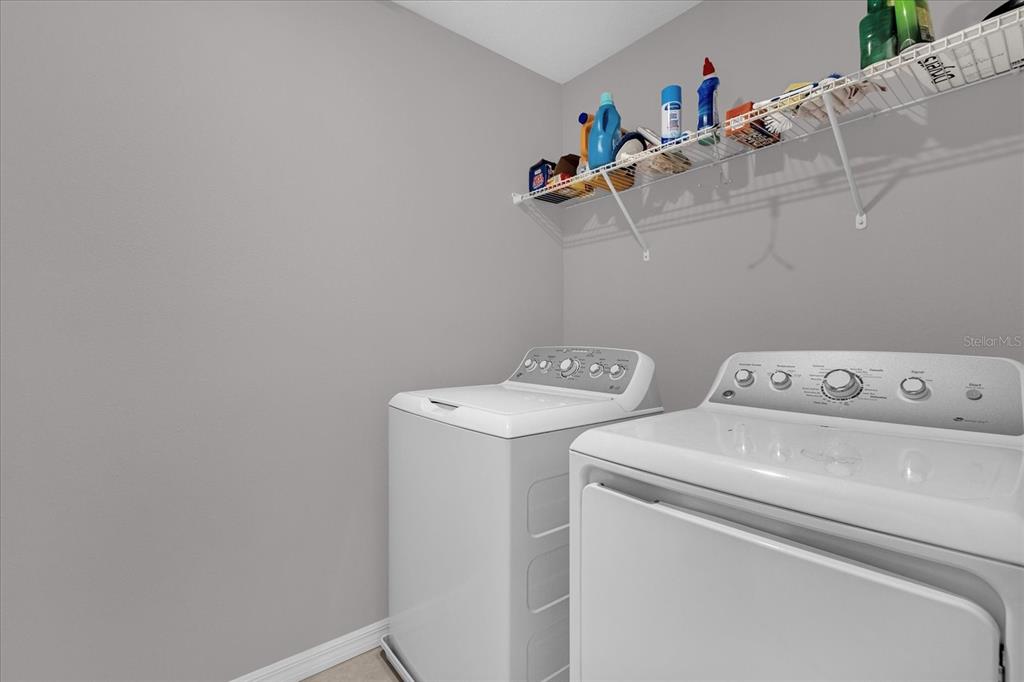 3470 Beau Road Kissimmee, FL 34746 - Photo 32 of 40 a utility room with dryer and washer