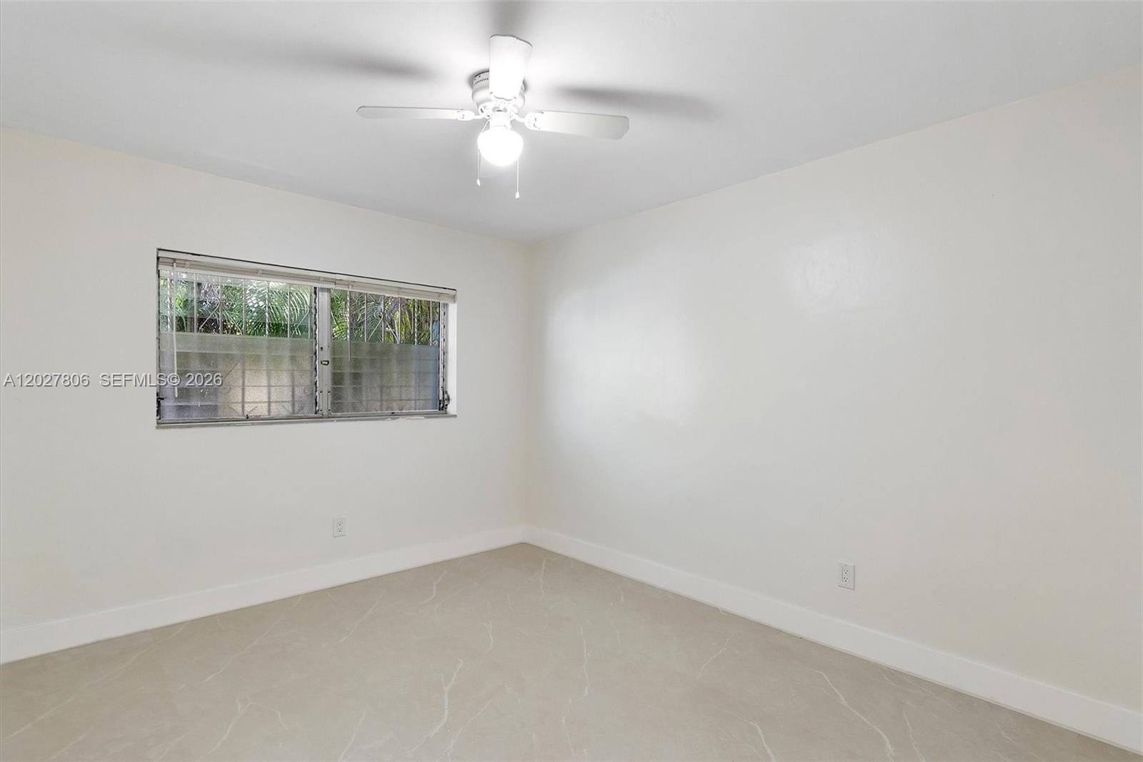 1612 Southwest 23rd Street, Unit 1612 Miami, FL 33145 - Photo 35 of 42 an empty room with a window