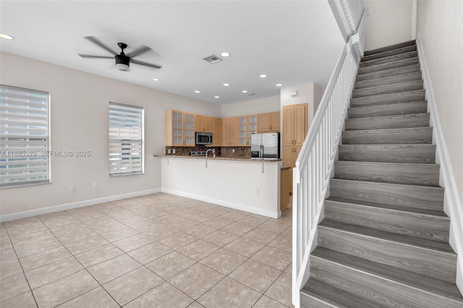 14634 Southwest 5th Street, Unit 15 Pembroke Pines, FL 33027 - Photo 19 of 56 a view of entryway and kitchen