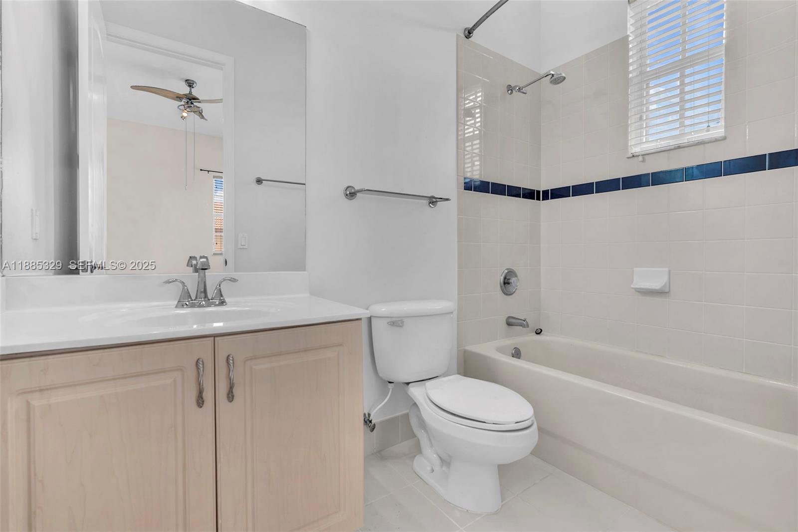 14634 Southwest 5th Street, Unit 15 Pembroke Pines, FL 33027 - Photo 22 of 56 a bathroom with a granite countertop sink a toilet and shower