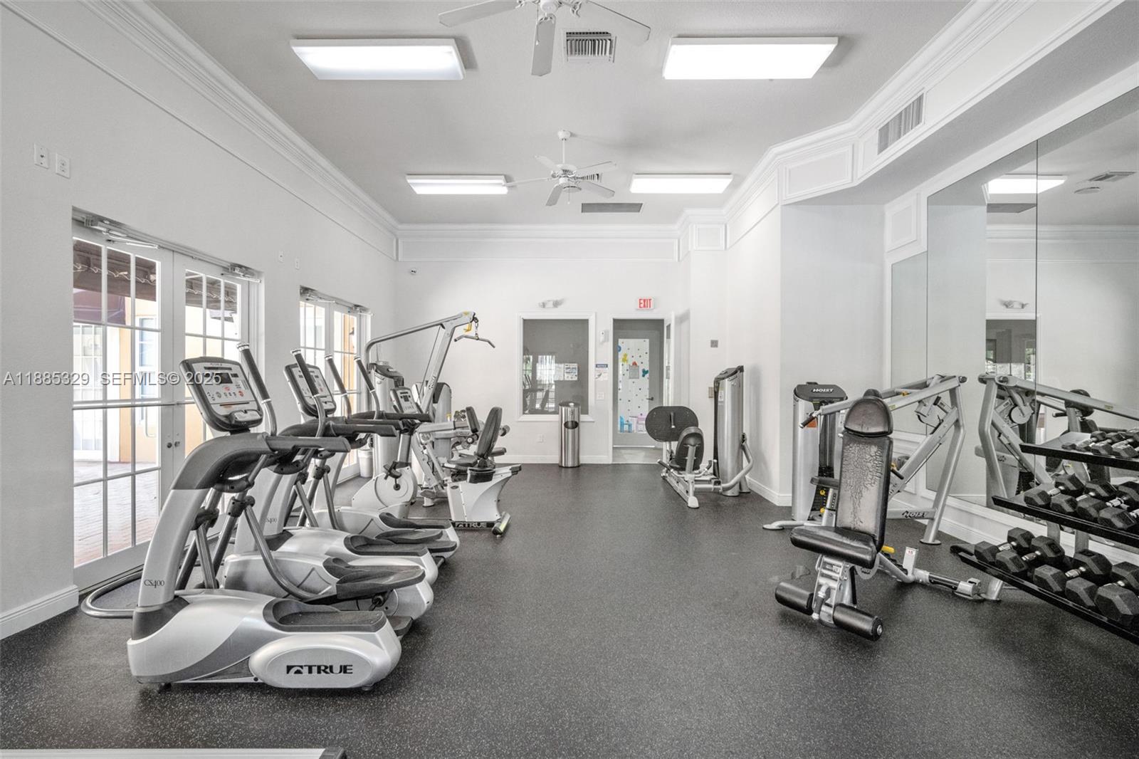 14634 Southwest 5th Street, Unit 15 Pembroke Pines, FL 33027 - Photo 43 of 56 a view of a room with gym equipment
