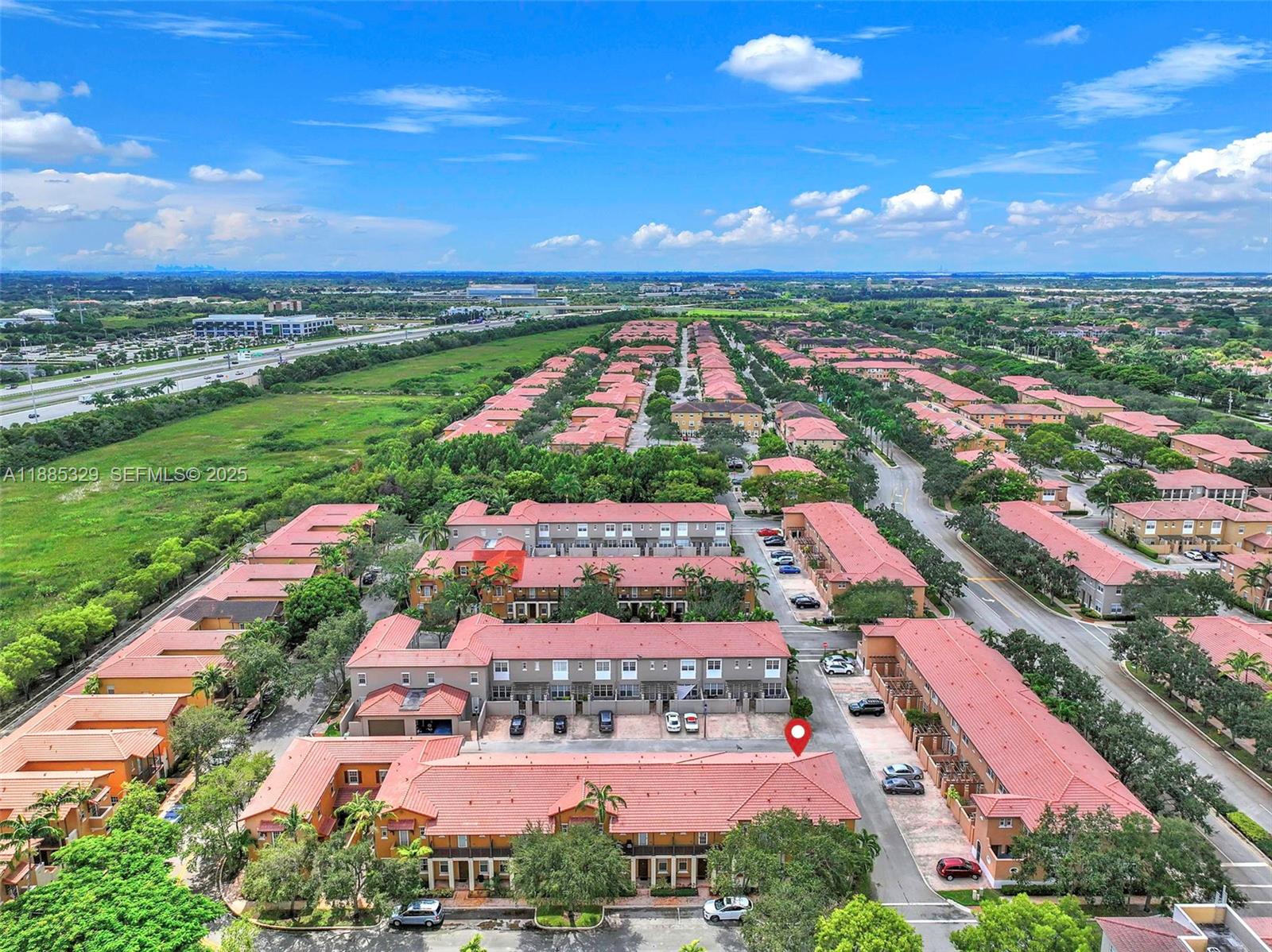14634 Southwest 5th Street, Unit 15 Pembroke Pines, FL 33027 - Photo 50 of 56 an aerial view of residential houses with outdoor space and ocean view