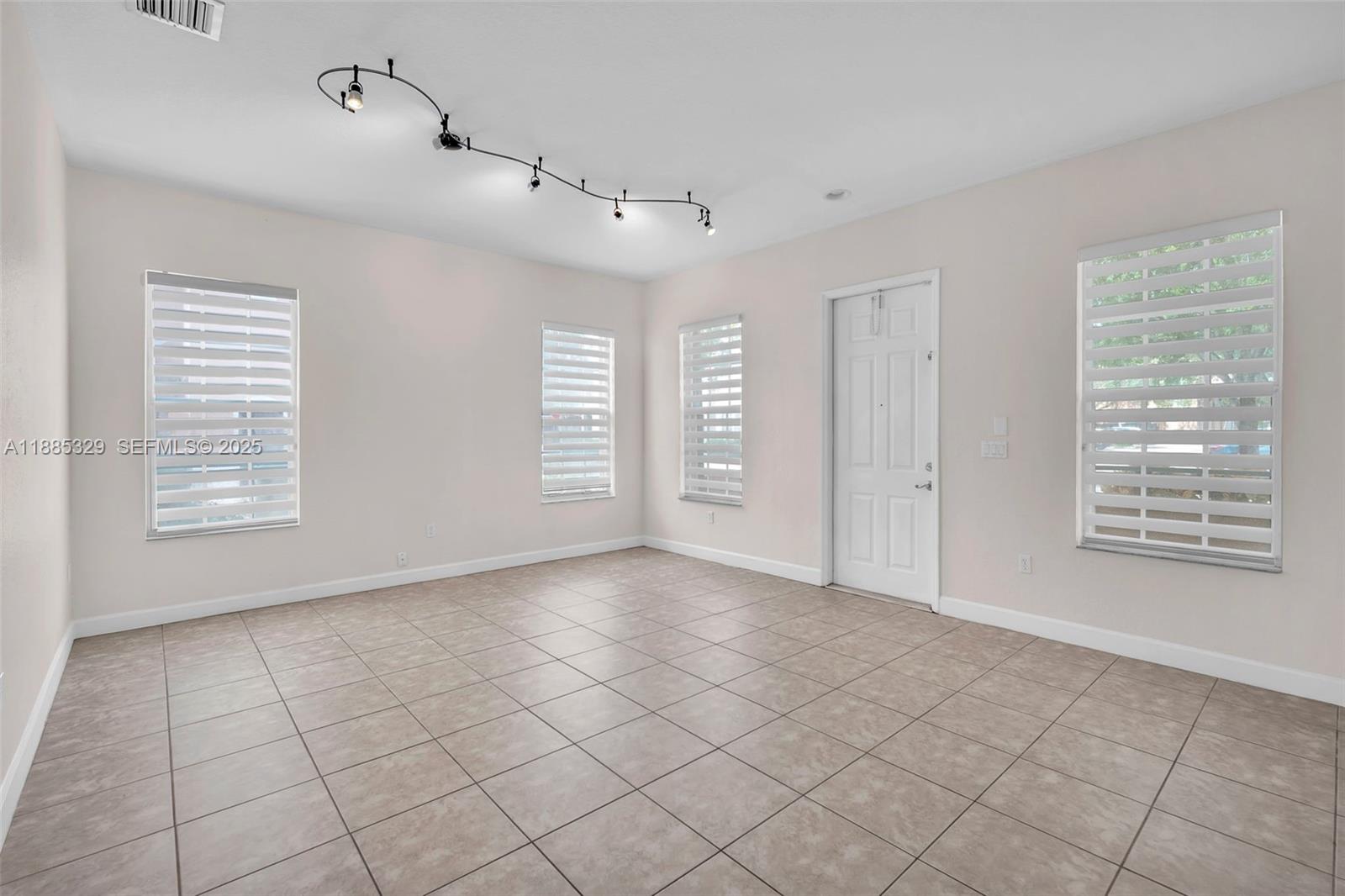14634 Southwest 5th Street, Unit 15 Pembroke Pines, FL 33027 - Photo 6 of 56 a view of an empty room with a window
