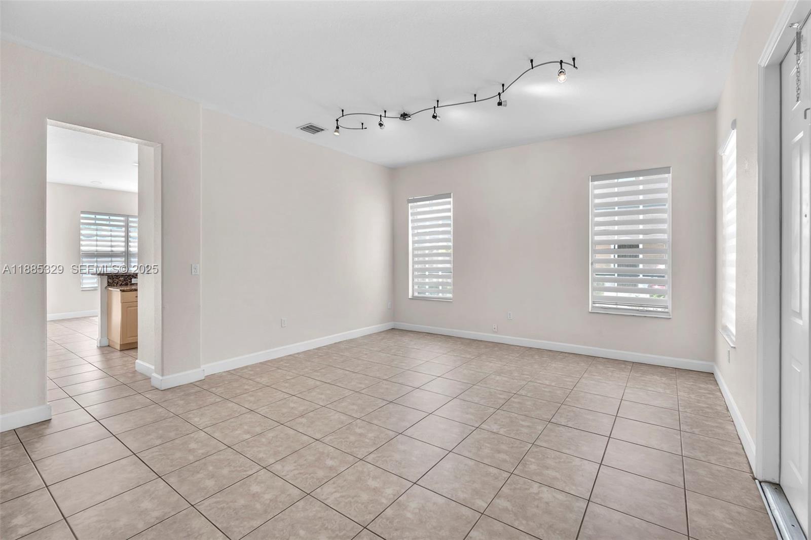14634 Southwest 5th Street, Unit 15 Pembroke Pines, FL 33027 - Photo 9 of 56 a view of an empty room with a window